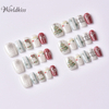 Ensemble de presse à ongles de Noël – Motif flocon de neige rouge et blanc avec colle et lime